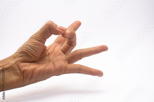 Close up photo of women hand preparing flick with her finger isolated on white background