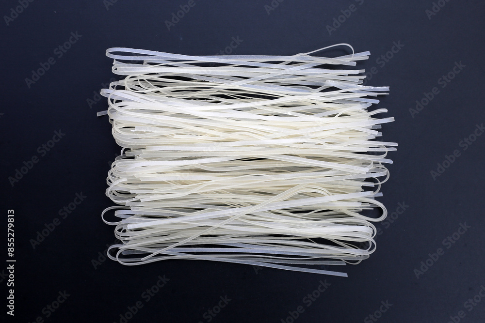 Dried uncooked rice noodles. Raw rice flour noodles Dried uncooked rice noodles. Raw rice flour noodles