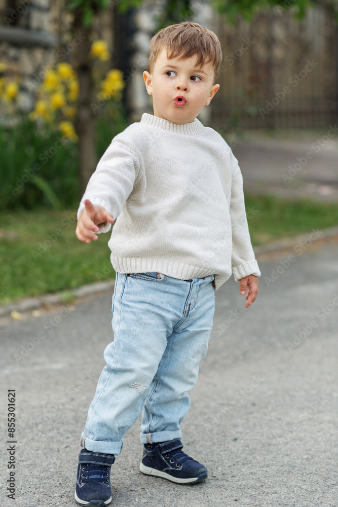 Curious toddler pointing and exploring outdoors Curious toddler pointing and exploring outdoors