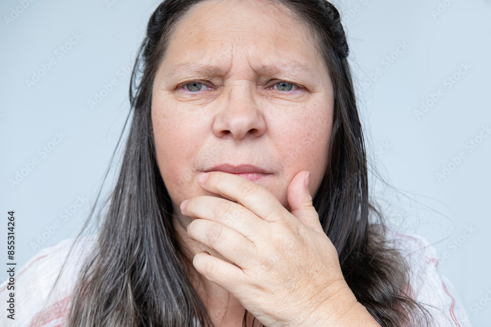 sorrowful face 55-year-old woman close-up, emotional distress and life challenges, midlife crisis, emotional turmoil, life difficulties, inner turmoil, feeling down sorrowful face 55-year-old woman close-up, emotional distress and life challenges, midlife crisis, emotional turmoil, life difficulties, inner turmoil, feeling down