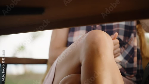 A Woman in a Short Skirt Crosses Her Legs, Peeking Under the Table. a Date at an Outdoor Restaurant.