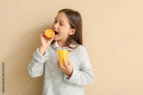 Cute little girl with glass...
