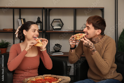 Happy young couple eating t...