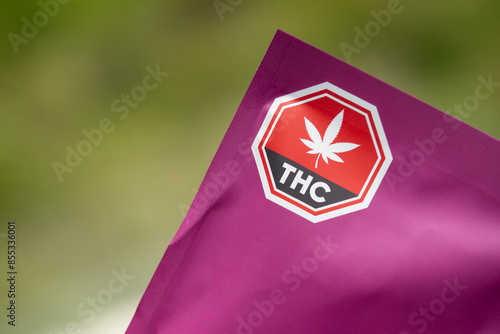 Package of cannabis edibles containing THC, marijuana label warming