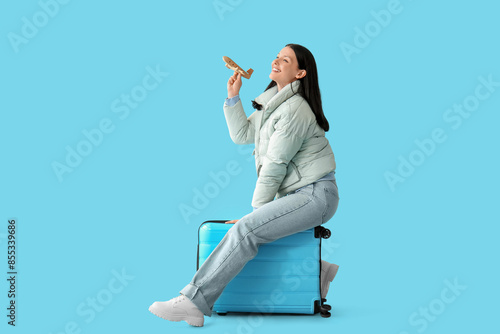 Happy young woman with wood...