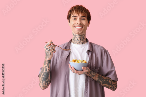 Man holding bowl with cerea...