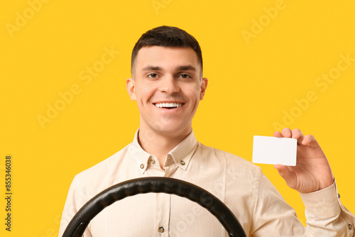 Young man with steering whe...