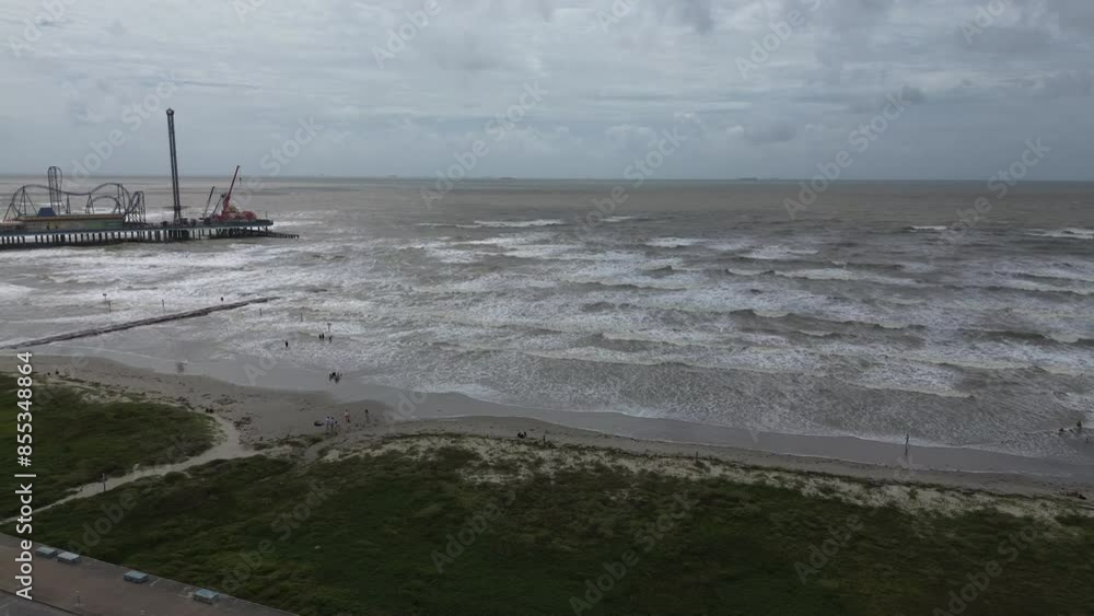 Waves from rough surf crashing onto the barrier island of Galveston, Texas during a tropical system that moved through the area. Waves from rough surf crashing onto the barrier island of Galveston, Texas during a tropical system that moved through the area.