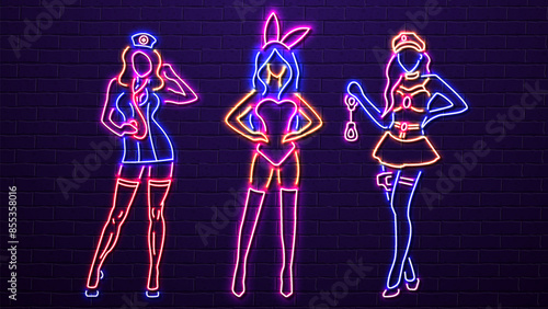 Sexy neon girls in lingerie on a brick wall background. A concept for a sex shop.