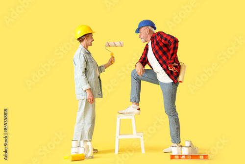 Mature couple in hardhats w...