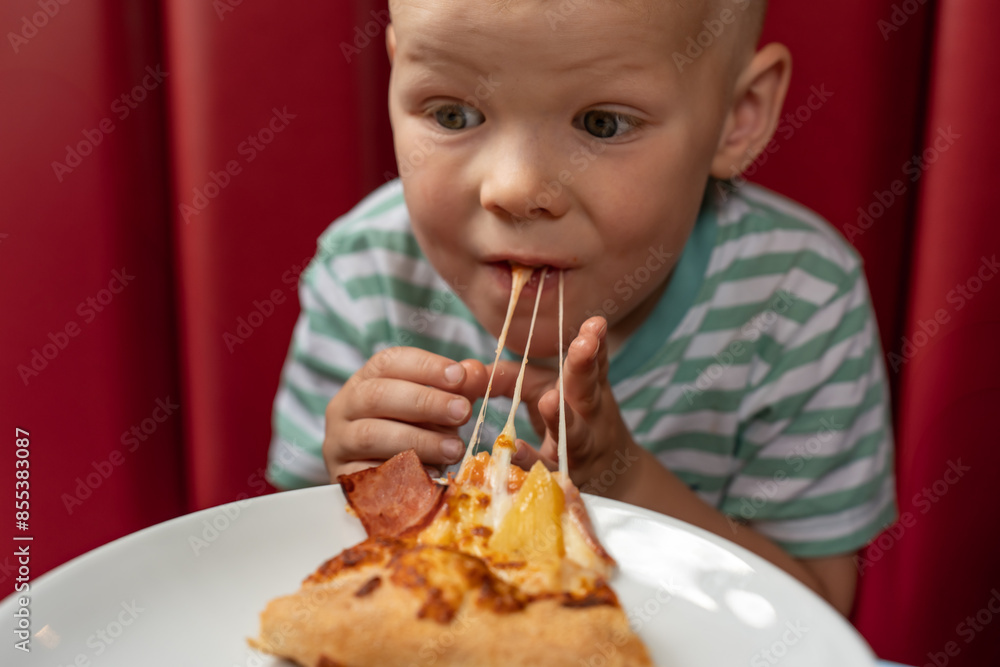 Close-up of one child eClose-up of one child enjoying a large pizza. Children's meals while travelling. Unhealthy food. njoying a large pizza. Children's meals while travelling. Unhealthy food. High Close-up of one child eClose-up of one child enjoying a large pizza. Children's meals while travelling. Unhealthy food. njoying a large pizza. Children's meals while travelling. Unhealthy food. High