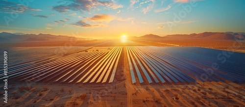 Harnessing Solar Power: Aerial View of Photovoltaic Plant in Desert Landscape