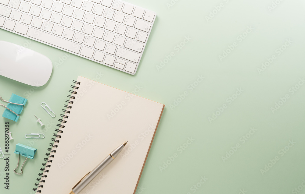 Flat lay, top view office table desk. Workspace with keyboard, office supplies and flower on pastel background. Flat lay, top view office table desk. Workspace with keyboard, office supplies and flower on pastel background.