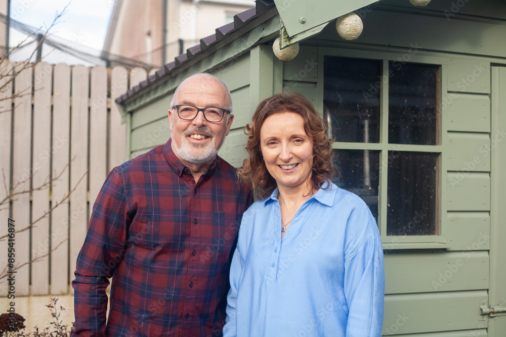 elderly man and woman relaxing at home or garden in casual clothes elderly man and woman relaxing at home or garden in casual clothes