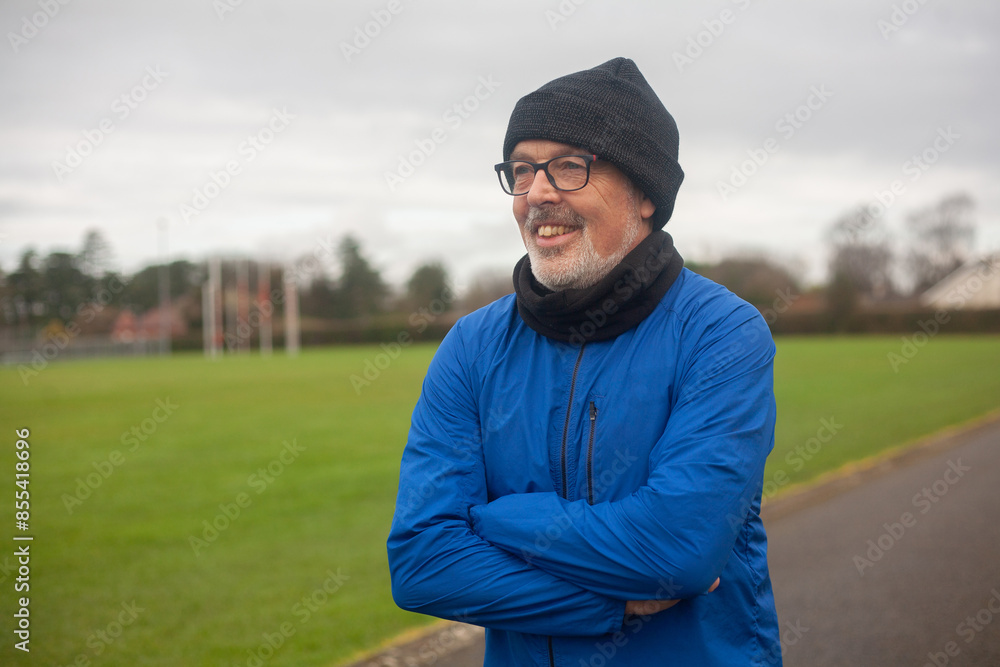 An elderly man goes in for sports, runs in the fresh air in sportswear An elderly man goes in for sports, runs in the fresh air in sportswear