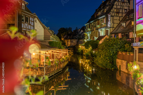 A colored night and reflection in Petite Venise of Colmar in France on 15th march 2024 photo