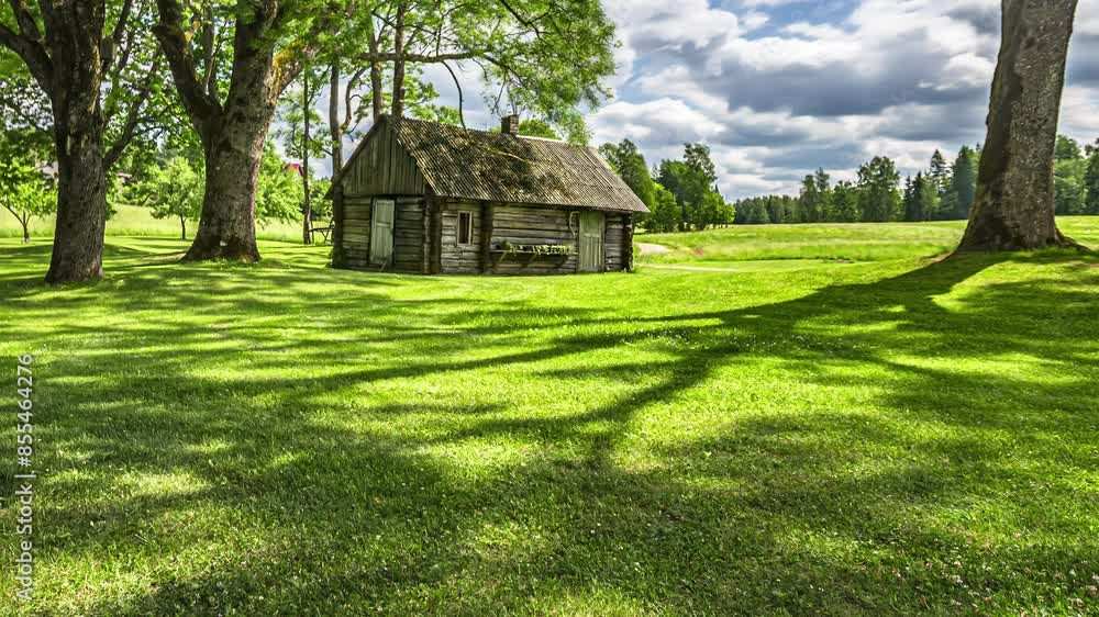 Cutting the lawn with a riding mower at a countryside cabin - time lapse Cutting the lawn with a riding mower at a countryside cabin - time lapse