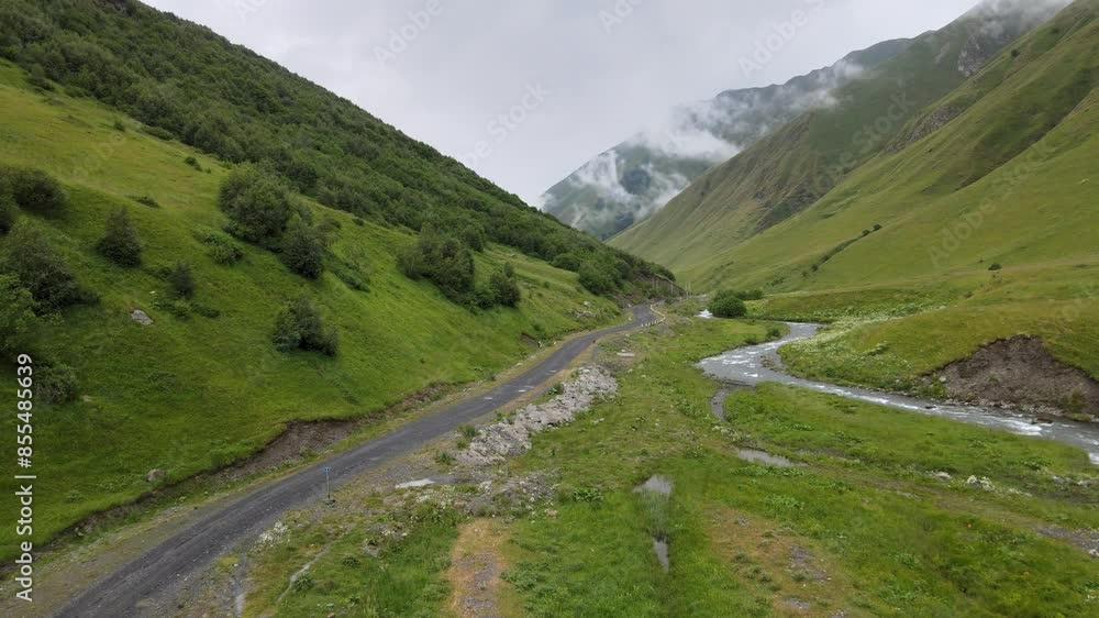 drone shot of valley village road river and cloud in the sky caucasian mountains drone shot of valley village road river and cloud in the sky caucasian mountains