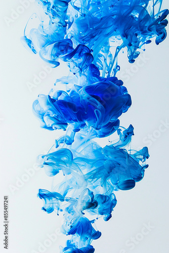 Abstract blue ink swirling in water, creating a dynamic and fluid design