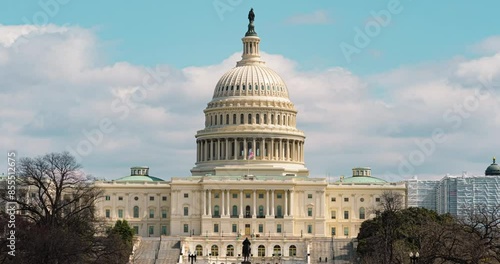 Time lapse of The United States Capitol Building and the United States Congress with cityscape and cloudscape in Capitol Hill, Washington, D.C., United States photo