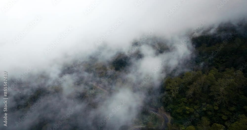 Flying Through Clouds Over Mount Agung Hillside During Sunrise In Bali, Indonesia. Aerial Shot Flying Through Clouds Over Mount Agung Hillside During Sunrise In Bali, Indonesia. Aerial Shot