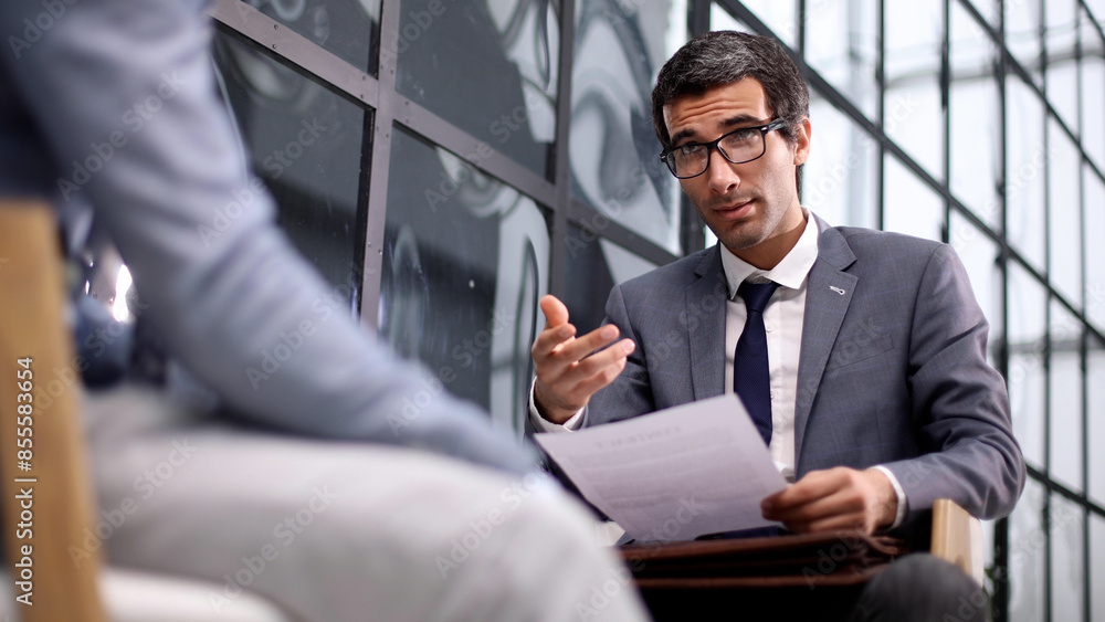 Confident male business team concluding a contract Confident male business team concluding a contract