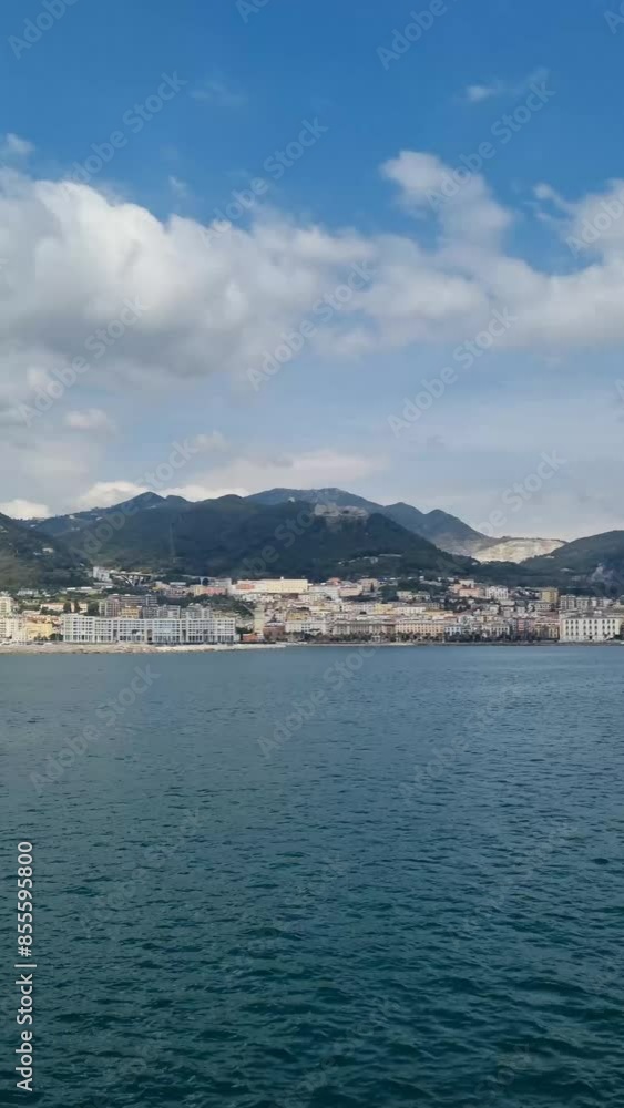 Scenic view from tourist ferry of boat cruising along Amalfi coast. Looking at hillside town houses on Amalfi coast from ferry boat on summertime day with
Scenic view from tourist ferry of boat cruising along Amalfi coast. Looking at hillside town houses on Amalfi coast from ferry boat on summertime day with