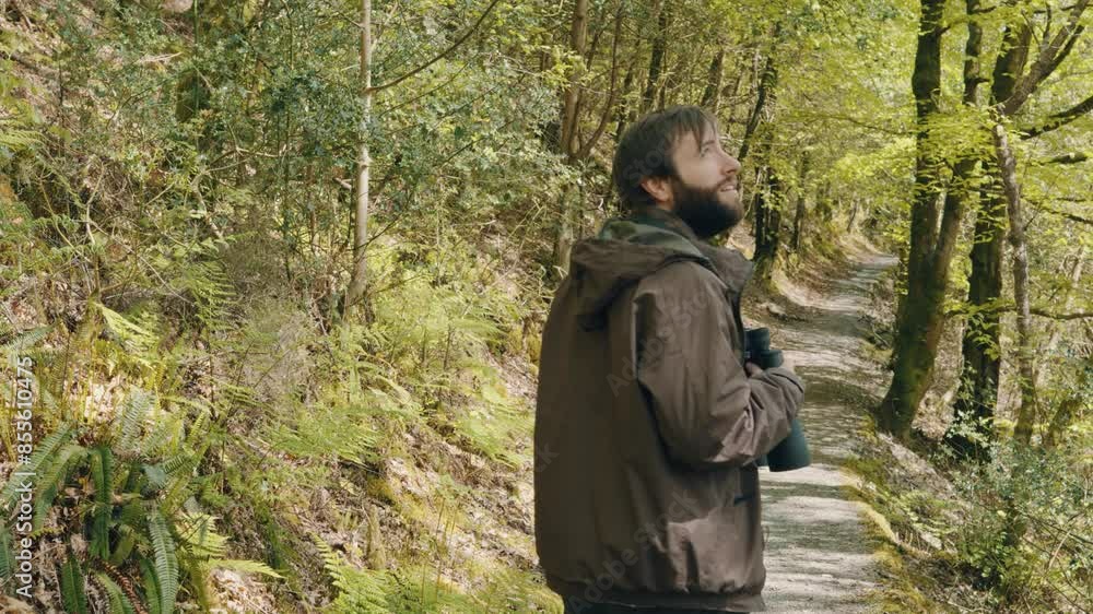 Young Male Birdwatcher Hobbyist Filmed from Behind Observing Nature Enjoying Great Outdoors Young Male Birdwatcher Hobbyist Filmed from Behind Observing Nature Enjoying Great Outdoors