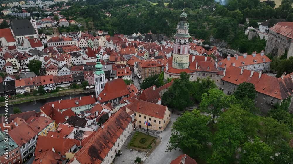 Český Krumlov, South Bohemia, Czechia, June 2023. Drone slowly orbits showing Chruch of St. Jost Medieval Castle and surrounding historic buildings. Český Krumlov, South Bohemia, Czechia, June 2023. Drone slowly orbits showing Chruch of St. Jost Medieval Castle and surrounding historic buildings.