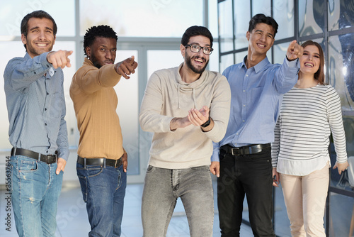 Portrait of excited young business pointing at you © Katsiaryna