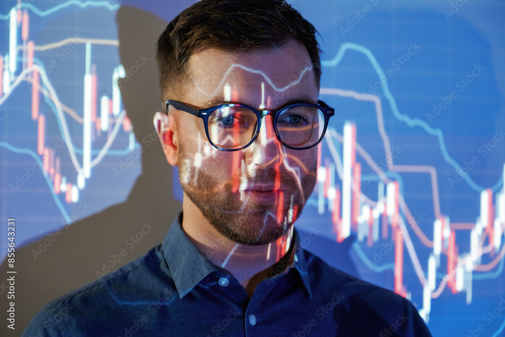 Close up portrait. Business coach against projector with data Close up portrait. Business coach against projector with data