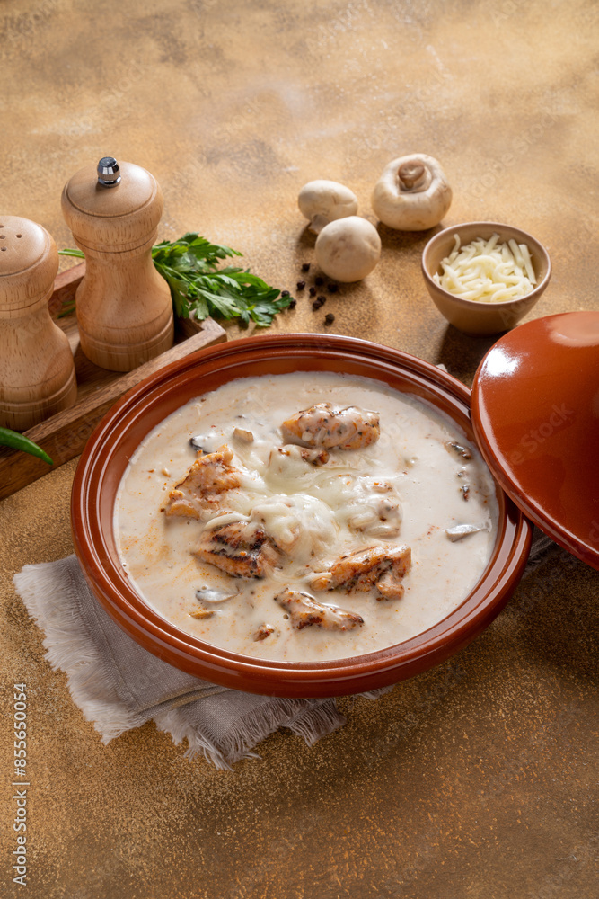 Grilled chicken cooked with mushroom sauce, covered with Cheese