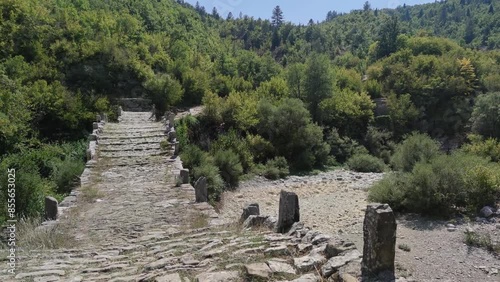 Amazing  view of Medieval Plakidas (Kalogeriko) Bridge at Pindus Mountains, Zagori, Epirus, Greece
 photo