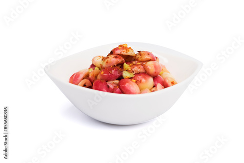 Fresh Bengal-currants, Carandas-plum, Karanda, a berry in tropical, mixed with dried red chili pepper sugar and salt in white bowl isolated on white background with clipping path. Top view. Flat lay.