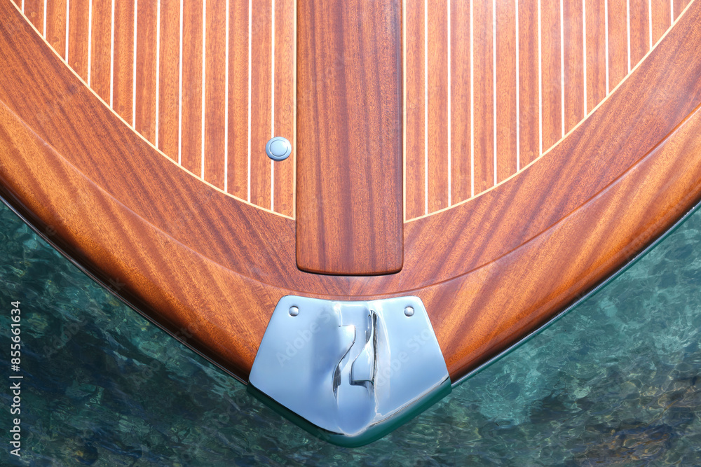 custom made wallpaper toronto digitalThe front of the Riva Aquarama boat, top view. Exclusive expensive wooden boat Riva Aquarama on azure water, top view. Detail of the front of the Riva boat, aerial view.