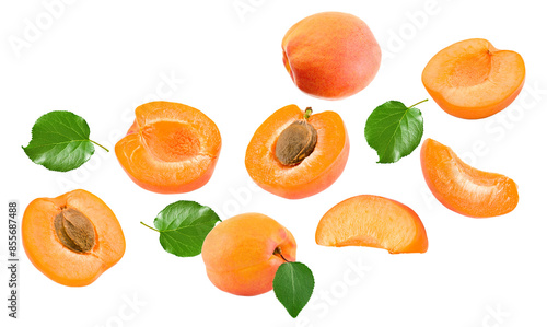 flying cut of apricot fruit with green leaves isolated on white background. clipping path