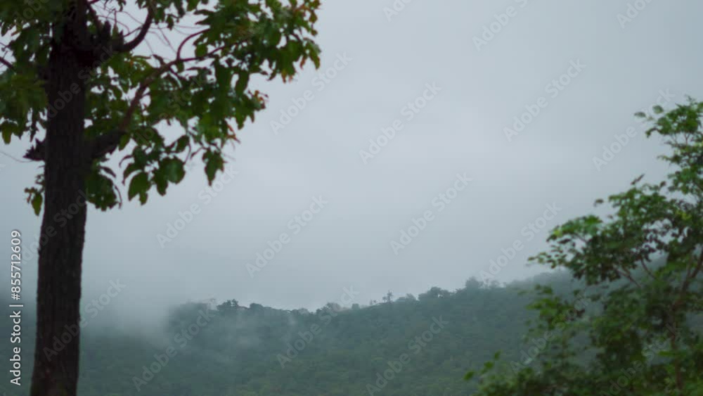 4K shot of clouds moving above the hills at Saputara hill station in Gujarat, India. Clouds move above the lush green Sahyadri hills during the monsoon season. Clouds above mountains in rainy season. 4K shot of clouds moving above the hills at Saputara hill station in Gujarat, India. Clouds move above the lush green Sahyadri hills during the monsoon season. Clouds above mountains in rainy season.