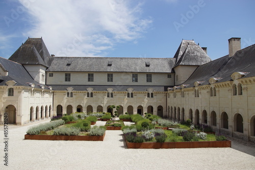 Courtyard, gardens with corten steel edging, St. Benedict’s Chapel and Infirmary. Fontevraud Abbey, Loire Valley, France. June, summer photo