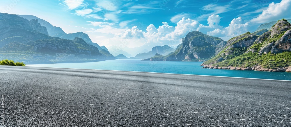 Asphalt road and mountain with blue sea natural landscape. Copy space image. Place for adding text or design
