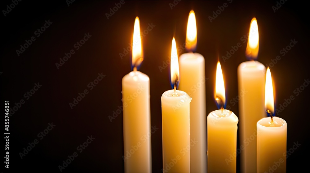 burning candles against a sleek black background, with ample space for text or designs. burning candles against a sleek black background, with ample space for text or designs.