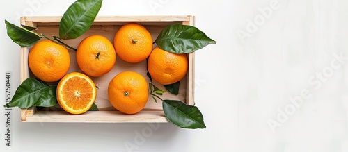 fresh orange fruit with lea...