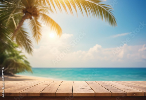 Top of wood table with seascape and palm tree, blur bokeh light of calm sea and sky at tropical beach background © Giuseppe Cammino