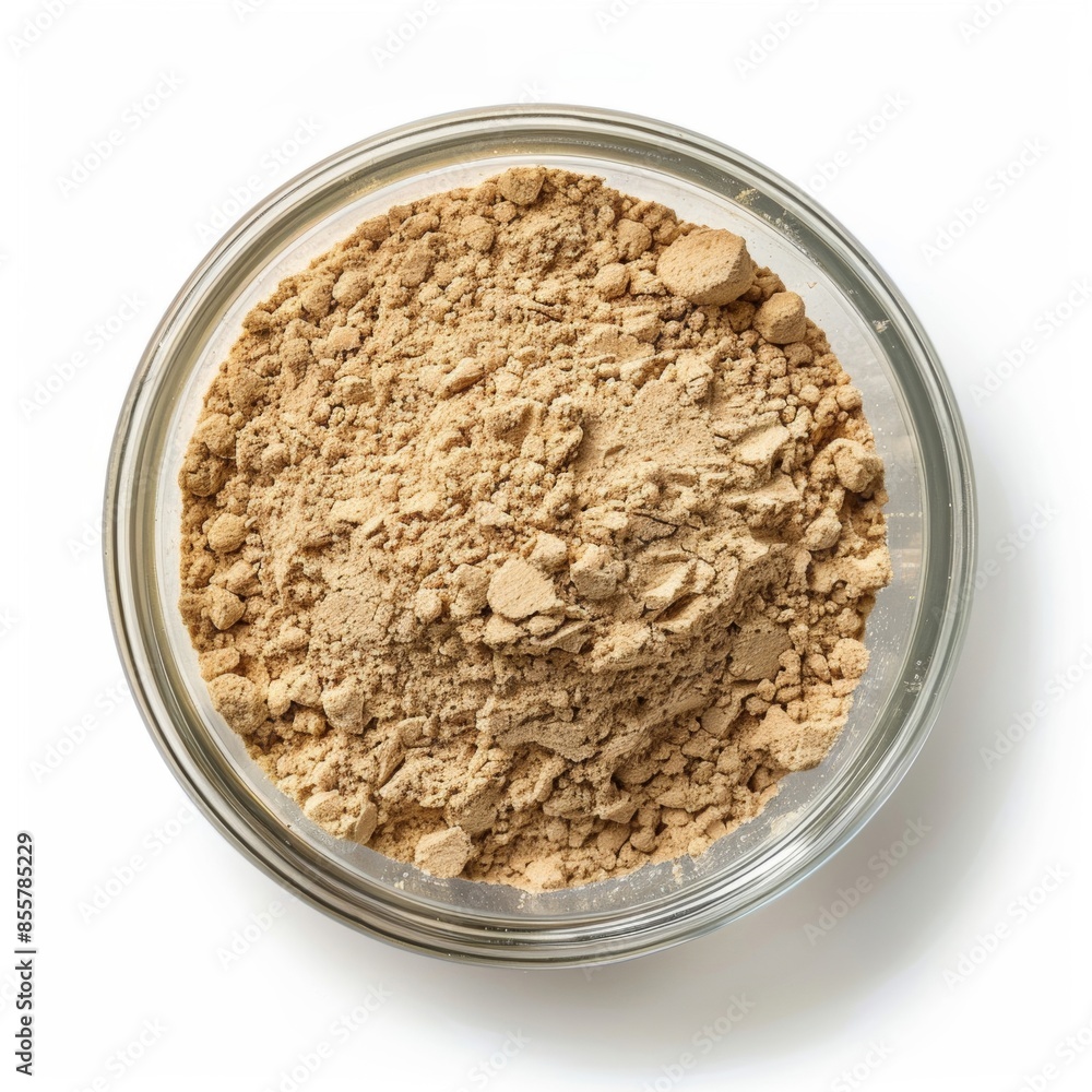 Isolated image of saw palmetto powder in a clear container on white background Isolated image of saw palmetto powder in a clear container on white background