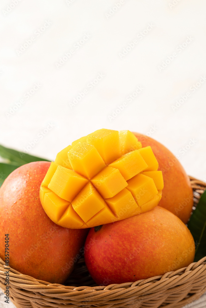 Fresh slice cut juicy mango on gray table background with leaf. Fresh slice cut juicy mango on gray table background with leaf.