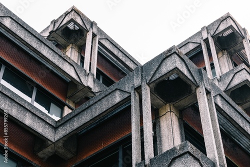 Close-up of a brutalist architecture building with concrete and brick materials.