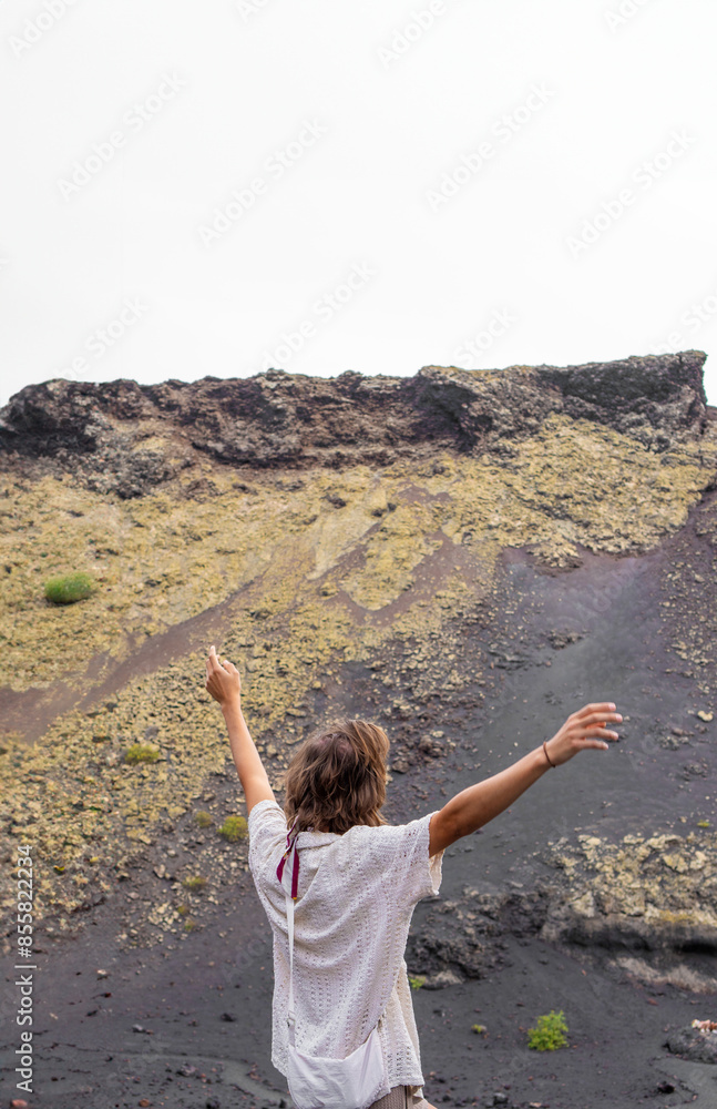 Young Man Embraces the Volcanic Landscape of El Cuervo, Lanzarote Young Man Embraces the Volcanic Landscape of El Cuervo, Lanzarote