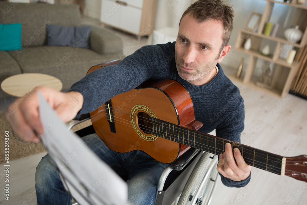 Obraz premium a focused musician playing guitar