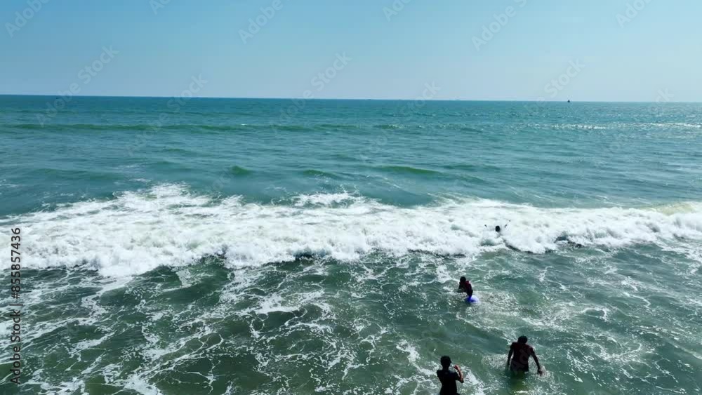 Breathtaking Aerial View of Tourists Enjoying Cox's Bazar, the World's Largest Sea Beach on a Sunny Day Breathtaking Aerial View of Tourists Enjoying Cox's Bazar, the World's Largest Sea Beach on a Sunny Day