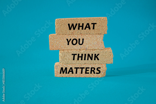 What You Think Matters symbol. Concept words What You Think Matters on brick blocks. Beautiful blue background. Motivational quote.