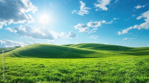 Rolling hills with lush green grass and a bright blue sky